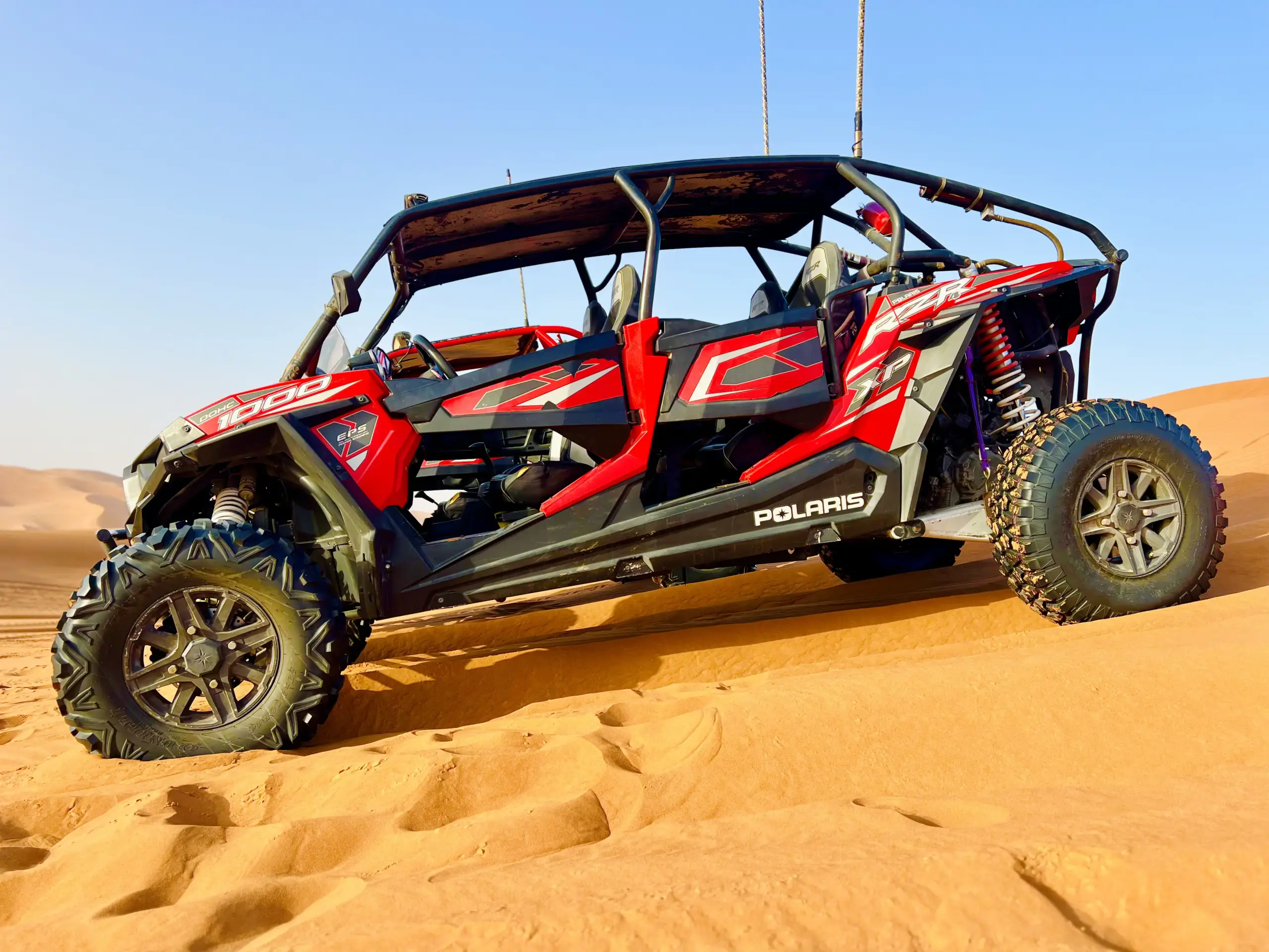 Quad bike rider conquering desert dunes
